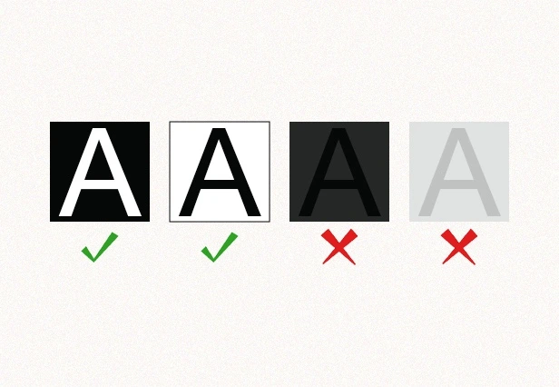 Visual comparison of ADA-compliant and non-compliant contrast in signage text using light-on-dark and dark-on-light backgrounds