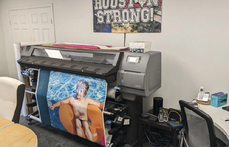 Printing of custom vinyl graphics for container used as mobile advertisement Printing of custom vinyl graphics for container used as mobile advertisement