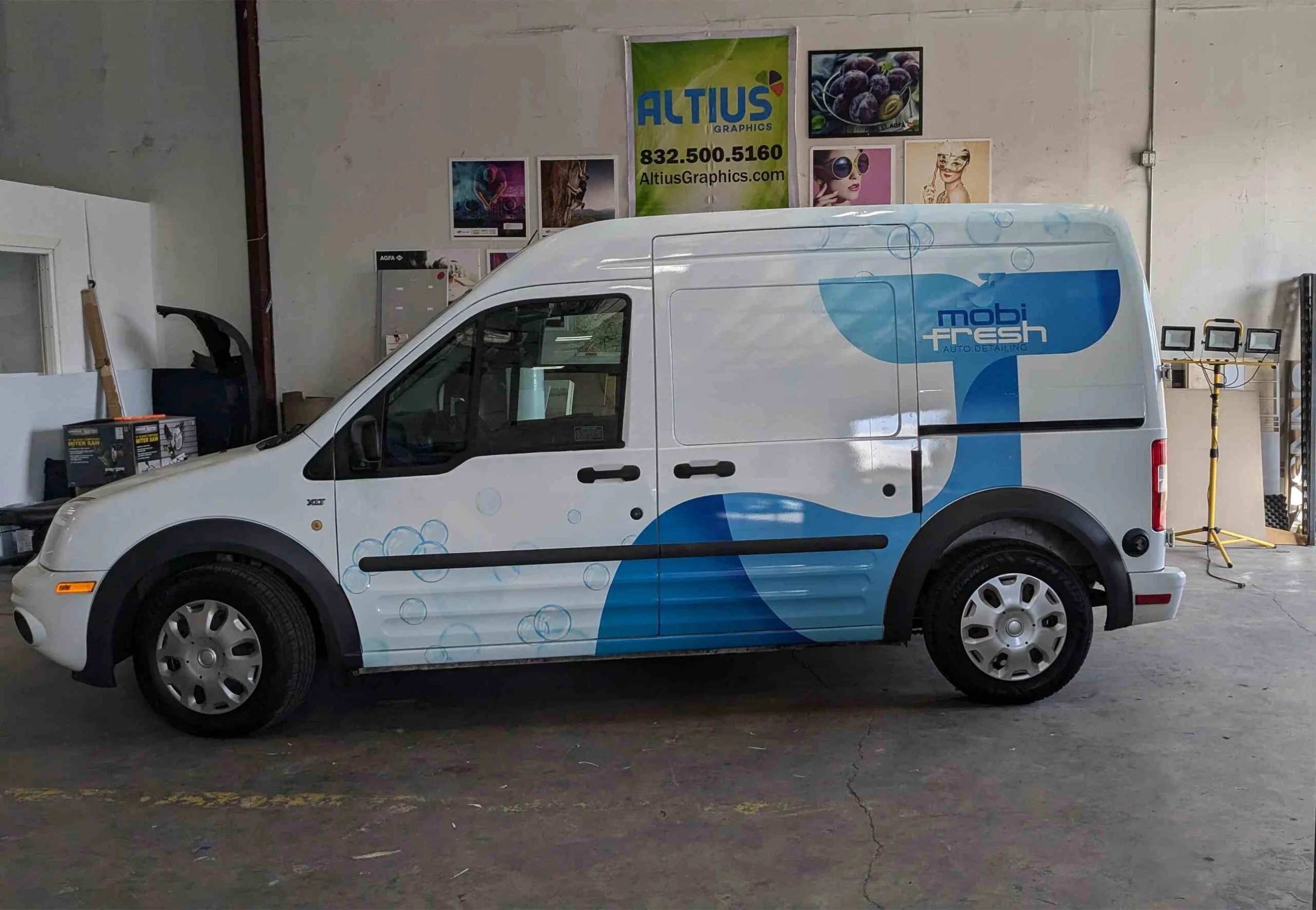 Partial fleet graphics application on logistics company vehicle doors and rear panels scaled